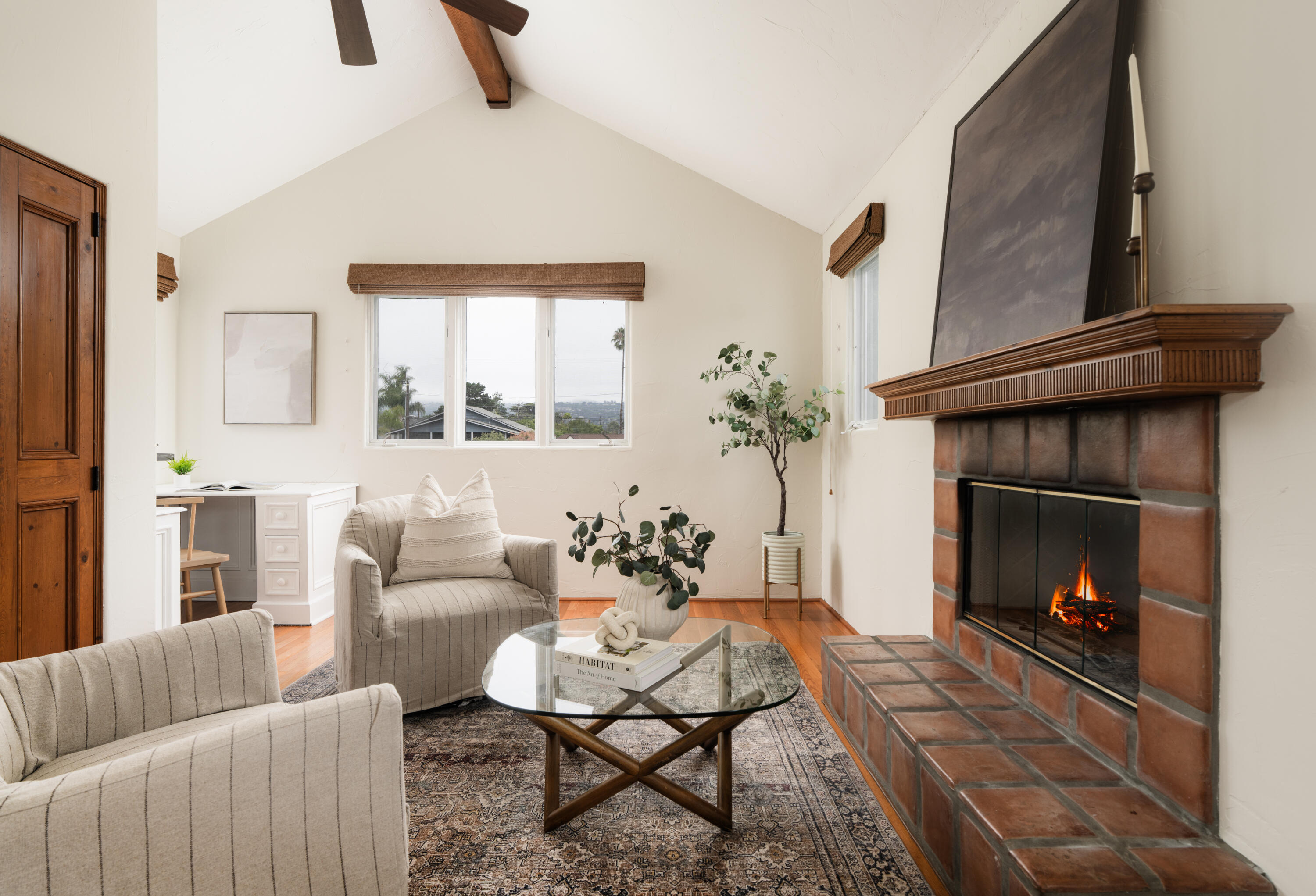 1740 Clearview Road Santa Barbara, CA 93101 - Photo 18 of 21 a living room with furniture and a fireplace