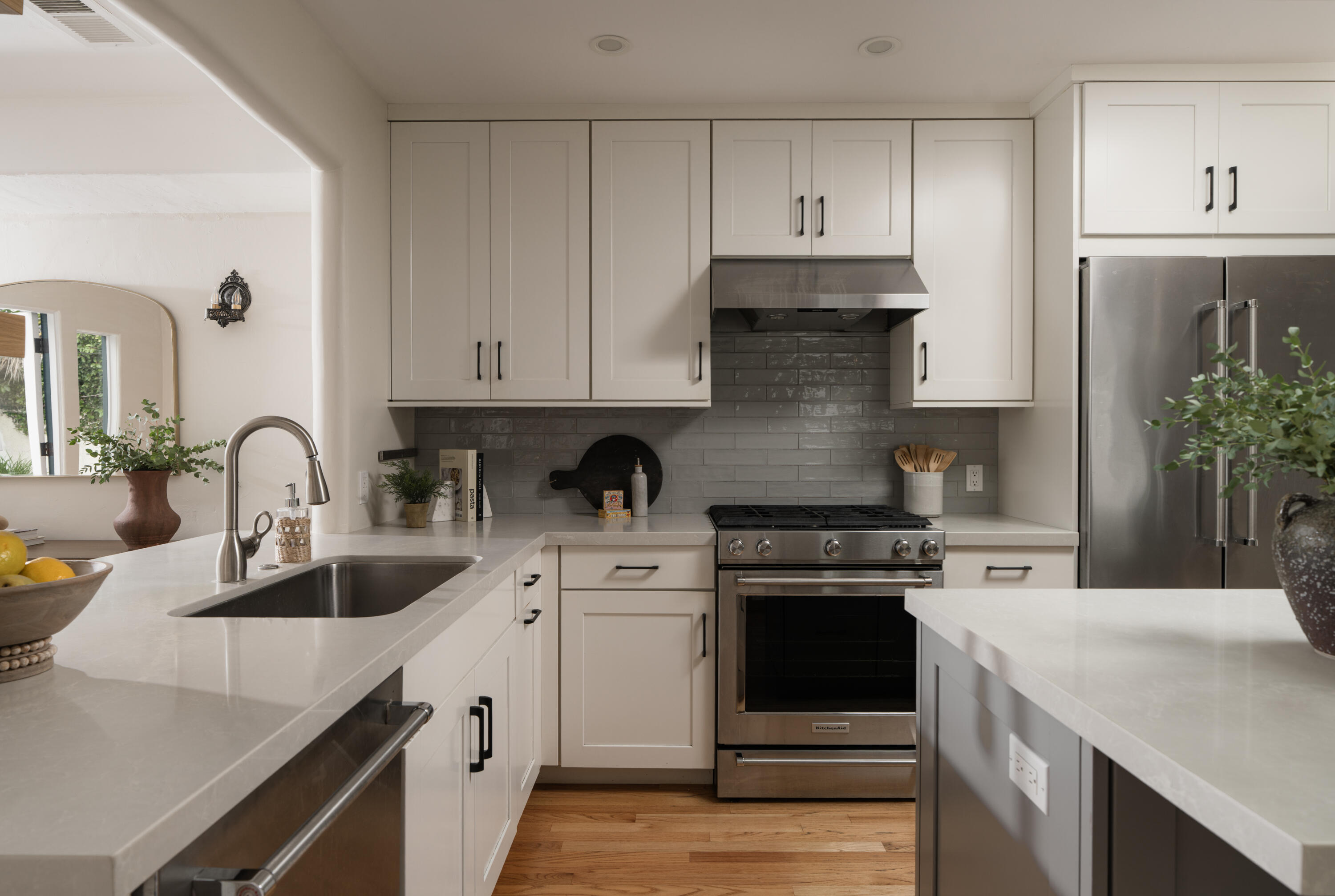1740 Clearview Road Santa Barbara, CA 93101 - Photo 6 of 21 a kitchen with white cabinets and white appliances
