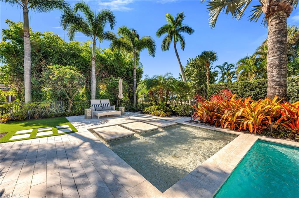 2025 Crayton Road Naples, FL 34102 - Photo 22 of 36 a view of a yard with palm tree