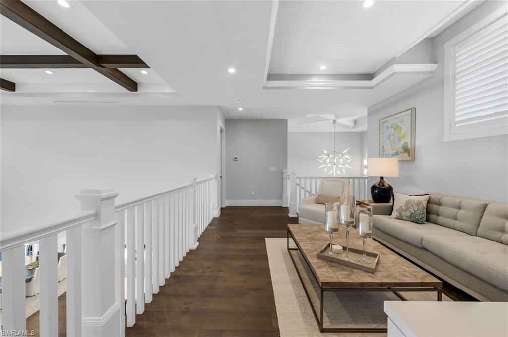 2025 Crayton Road Naples, FL 34102 - Photo 25 of 36 a living room with furniture fireplace and a window