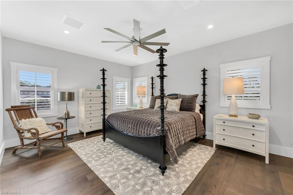 2025 Crayton Road Naples, FL 34102 - Photo 28 of 36 a bedroom with a bed and a window