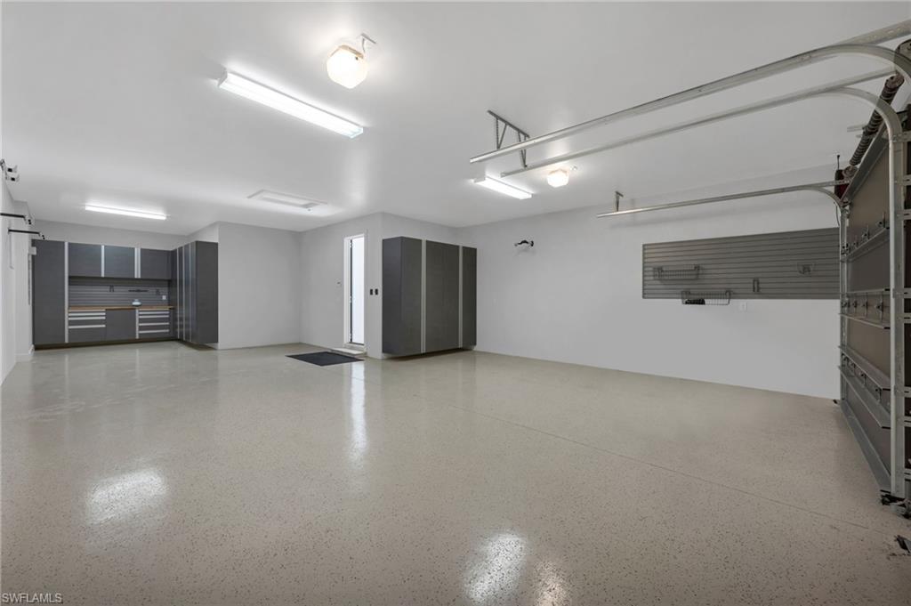 2025 Crayton Road Naples, FL 34102 - Photo 33 of 36 a view of a livingroom with a ceiling fan & window