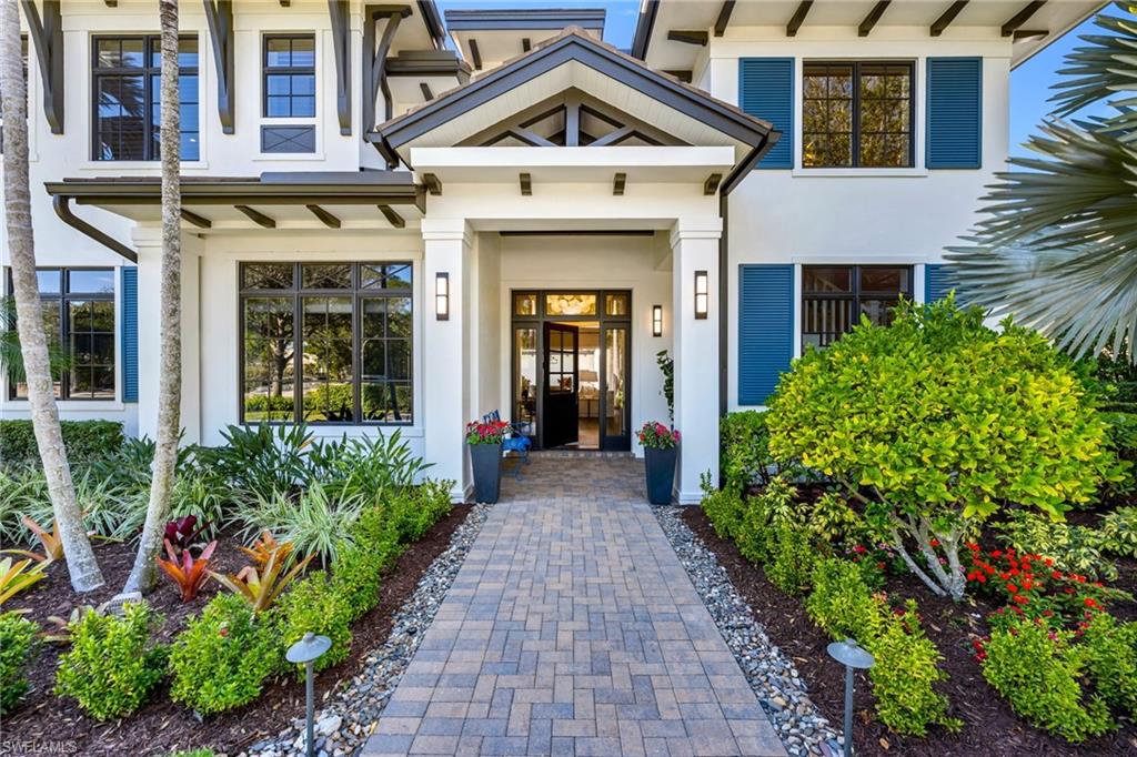 2025 Crayton Road Naples, FL 34102 - Photo 6 of 36 a view of a brick house with potted plants