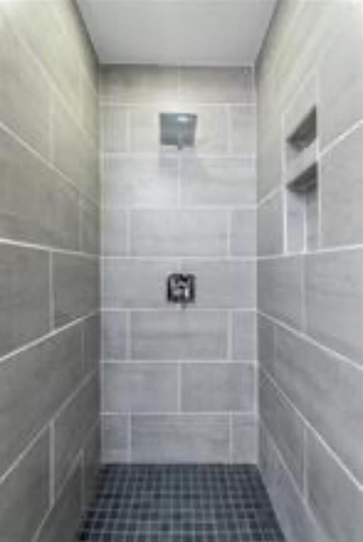 5808 Sandhurst Lane, Unit A Dallas, TX 75206 - Photo 6 of 9 a bathroom with a glass door shower