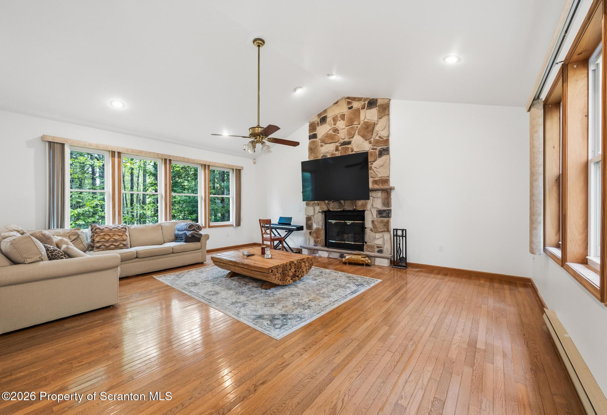 58 Bender Road Gouldsboro, PA 18424 - Photo 6 of 55 a living room with furniture fireplace and a flat screen tv