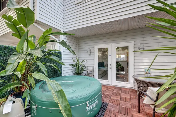a vase with flowers sitting on a table