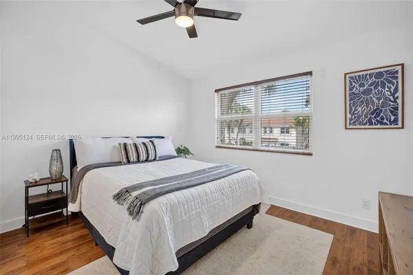 a bed room with a bed and a window