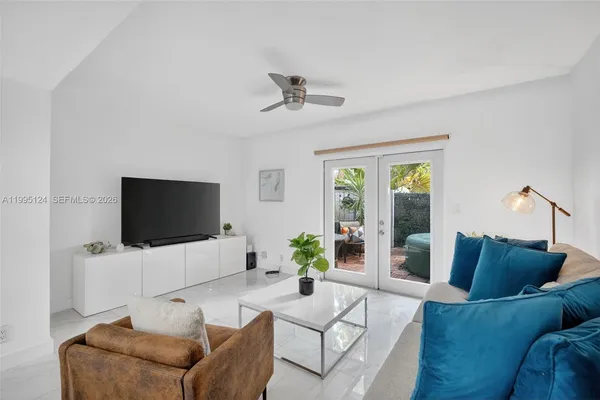 a living room with furniture and a flat screen tv