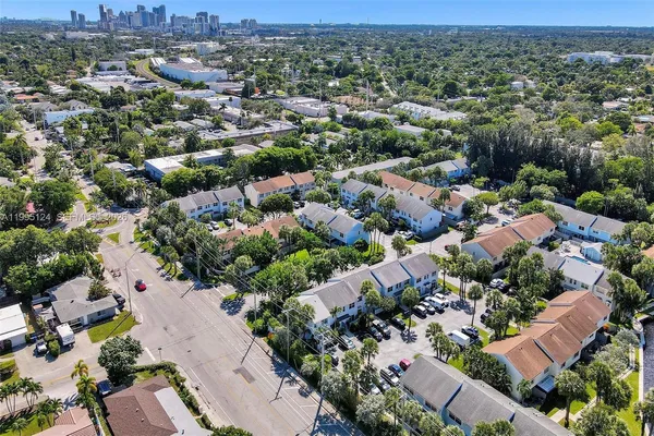 an aerial view of residential houses with outdoor space