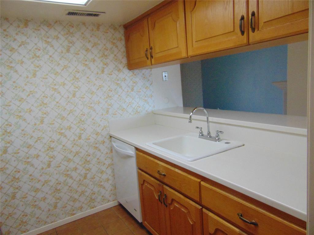 12806 Midway Road, Unit 2020 Dallas, TX 75244 - Photo 13 of 18 a bathroom with a sink and a mirror