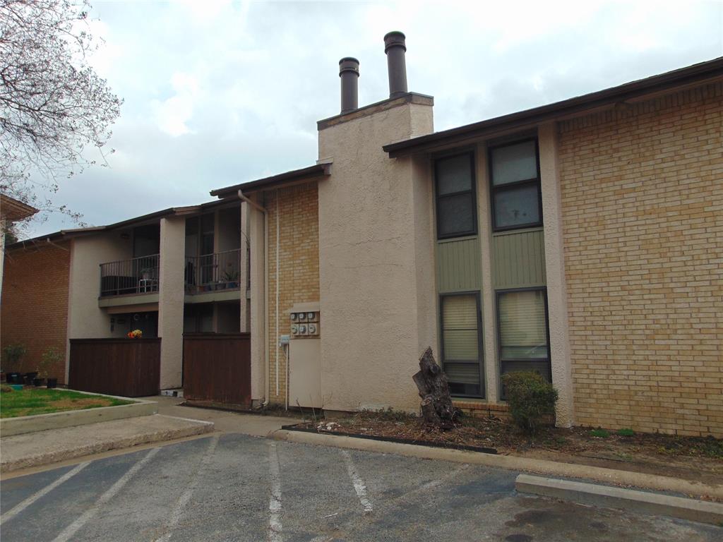 12806 Midway Road, Unit 2020 Dallas, TX 75244 - Photo 17 of 18 a front view of a house with a garage
