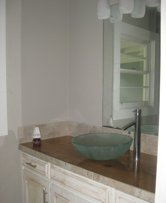 3220 Primrose Road Columbus, GA 31907 - Photo 14 of 16 a room with a sink and mirror
