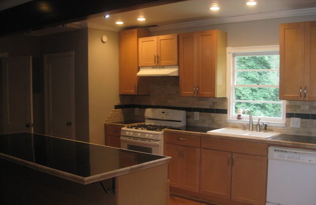 3220 Primrose Road Columbus, GA 31907 - Photo 4 of 16 a kitchen that has a sink and a stove in it