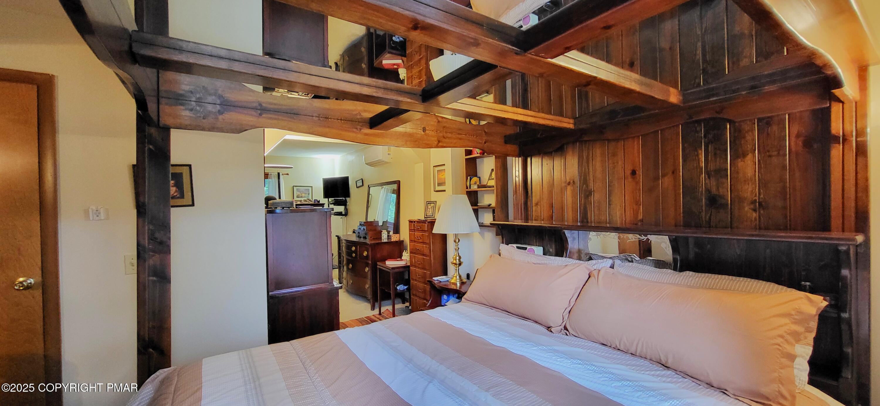 6116 Braintree Court Bushkill, PA 18324 - Photo 11 of 47 a bed room with a bed and a mirror