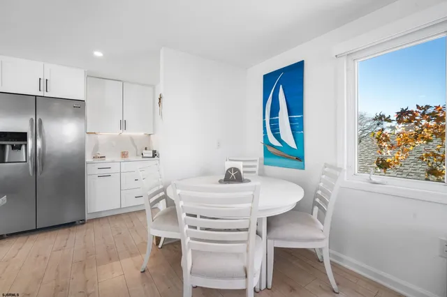 a kitchen with a sink cabinets and refrigerator