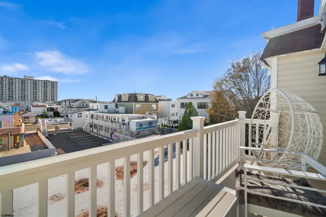 a view of a backyard with sitting area