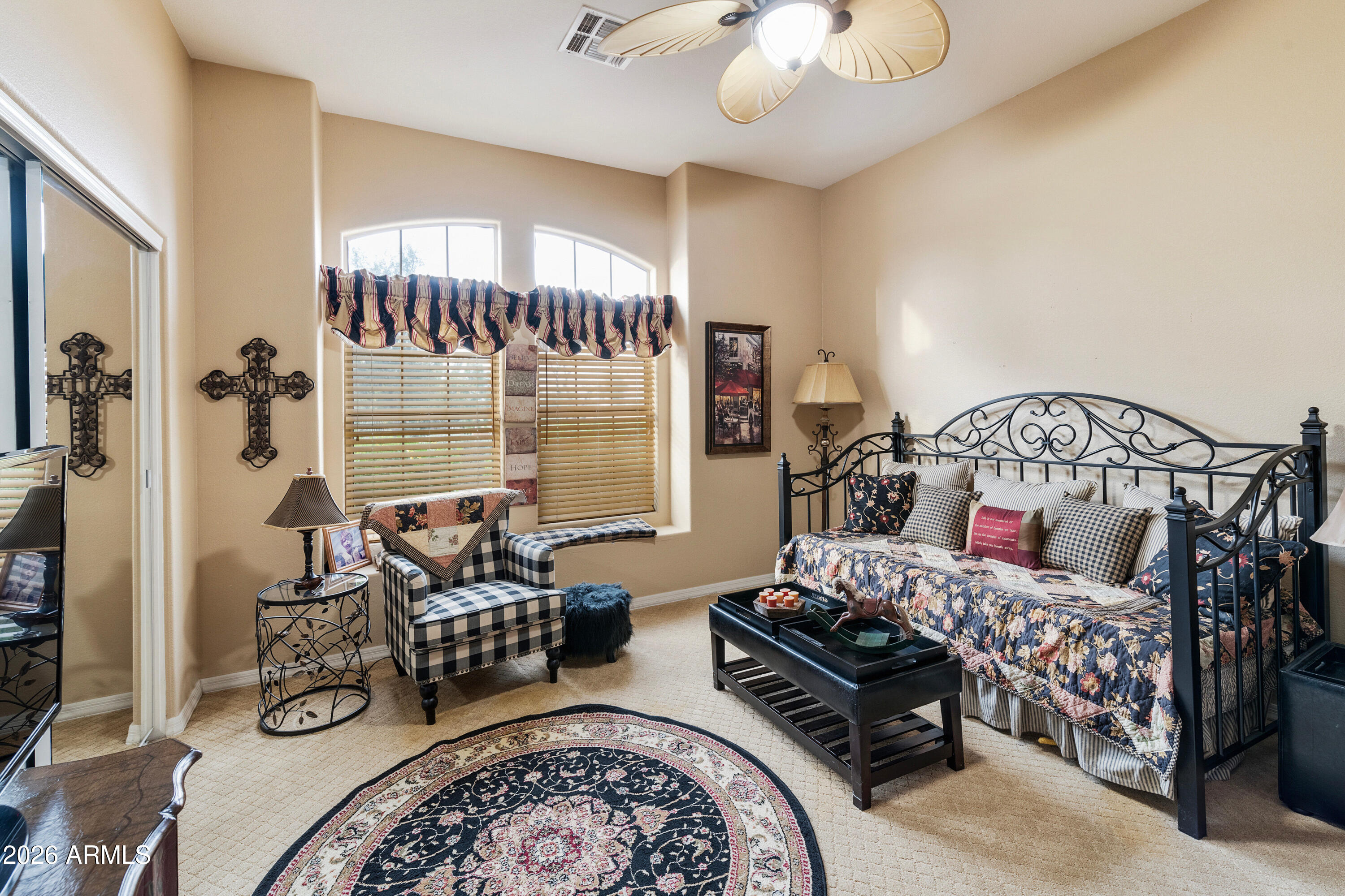 4100 East Strawberry Drive Gilbert, AZ 85298 - Photo 15 of 62 a bedroom with furniture and a large window