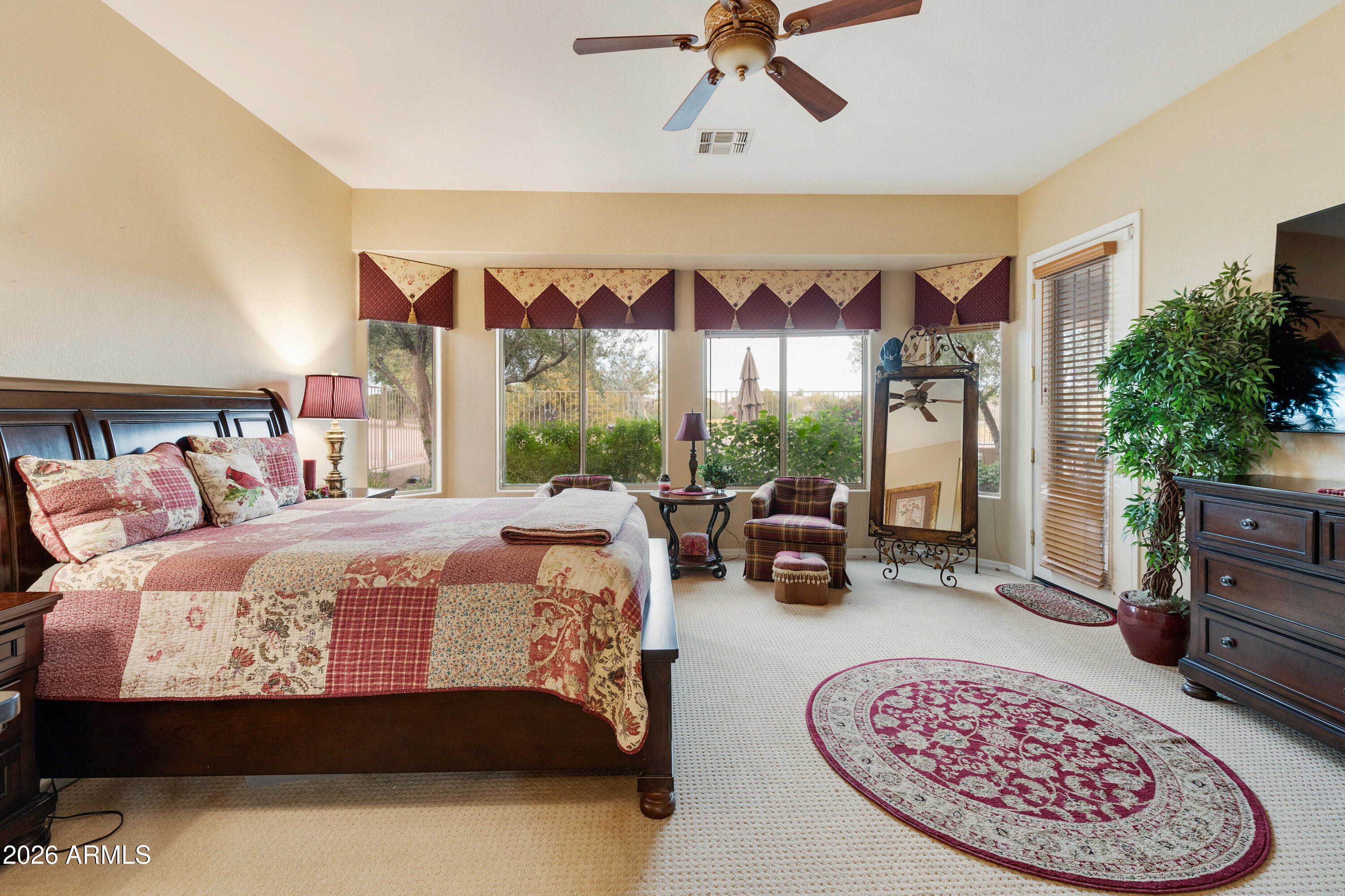 4100 East Strawberry Drive Gilbert, AZ 85298 - Photo 17 of 62 a bedroom with a bed a couch and dresser