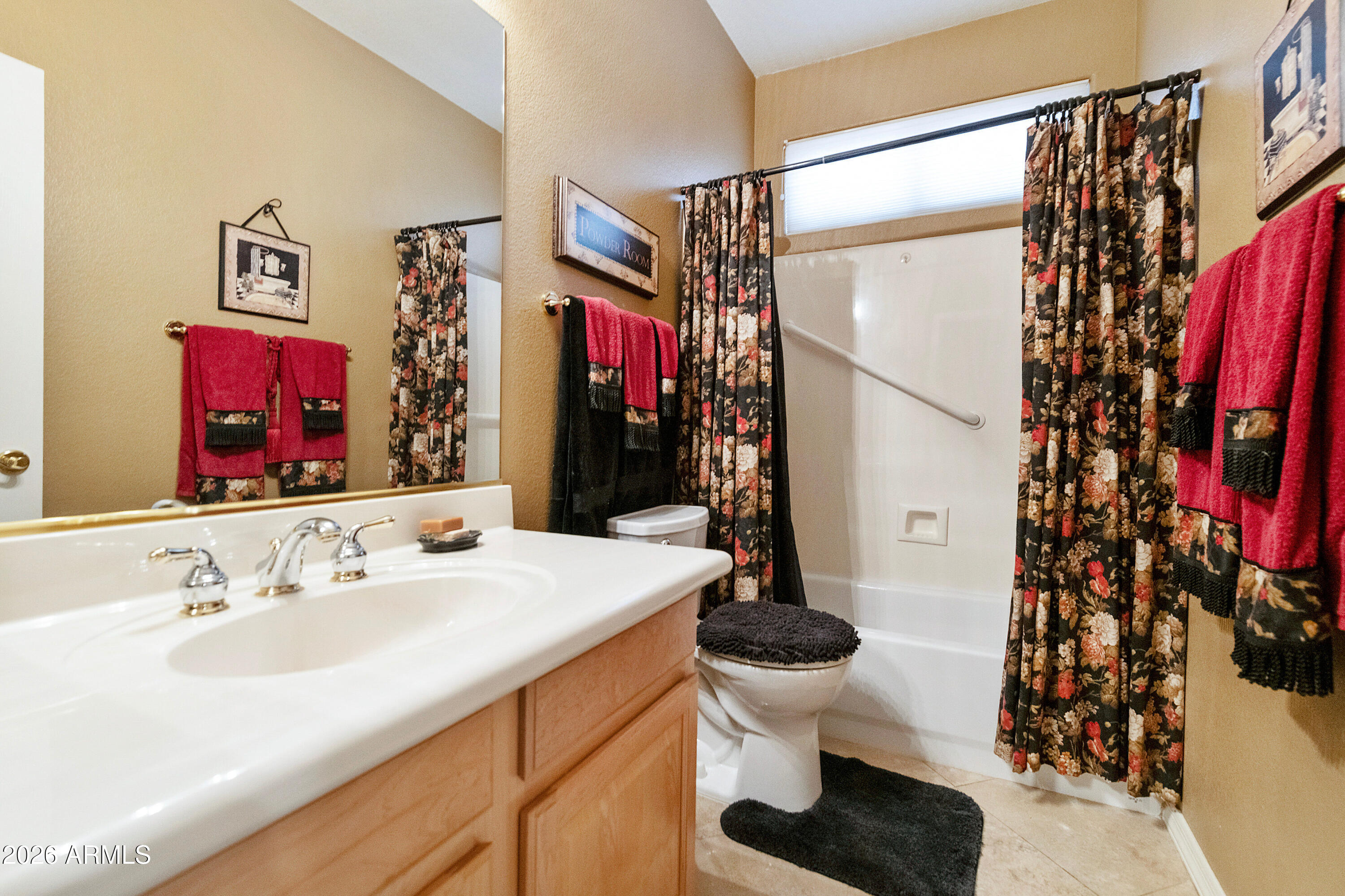 4100 East Strawberry Drive Gilbert, AZ 85298 - Photo 25 of 62 a bathroom with a sink toilet and shower