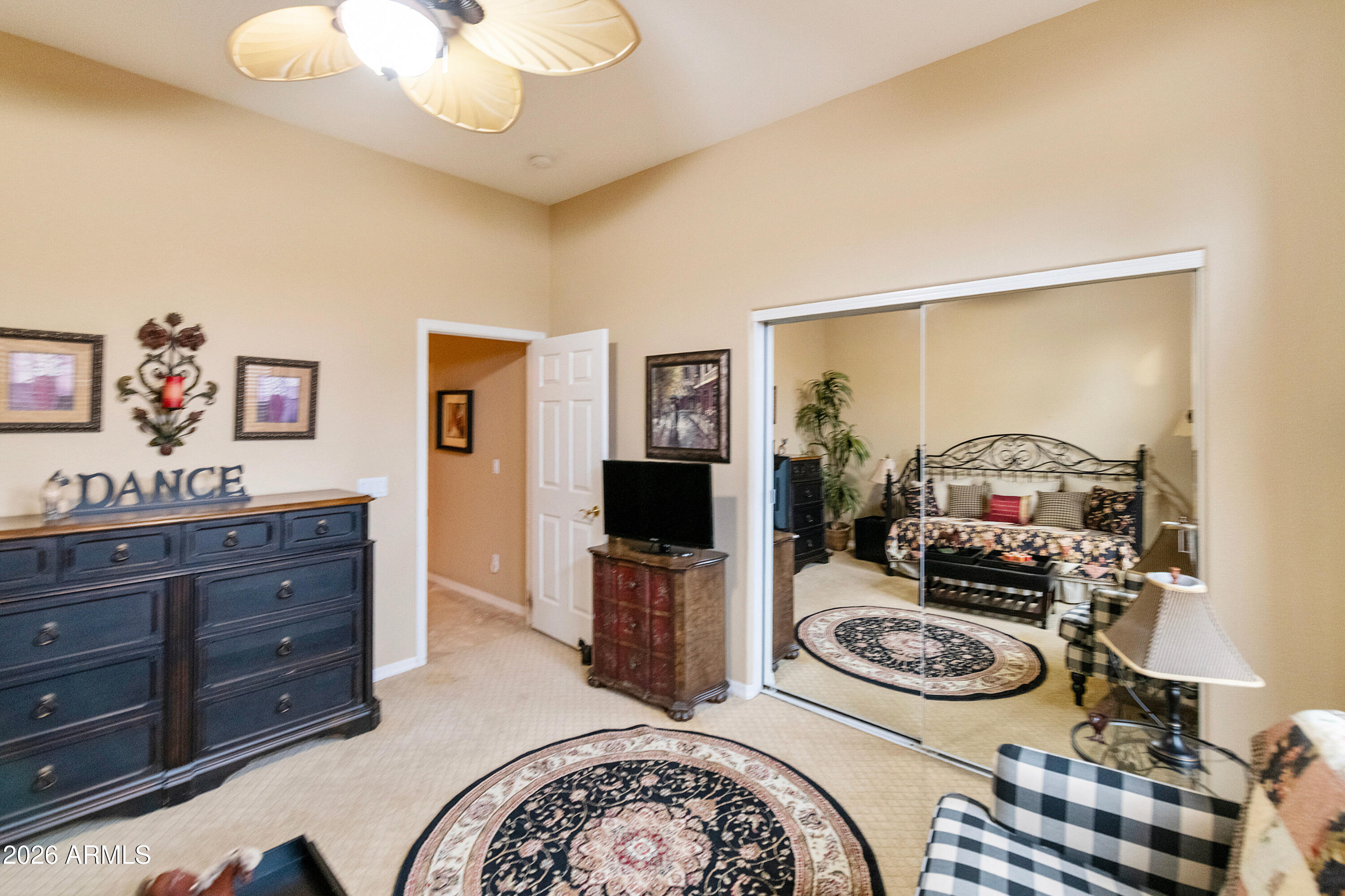 4100 East Strawberry Drive Gilbert, AZ 85298 - Photo 26 of 62 a living room with furniture and a fireplace