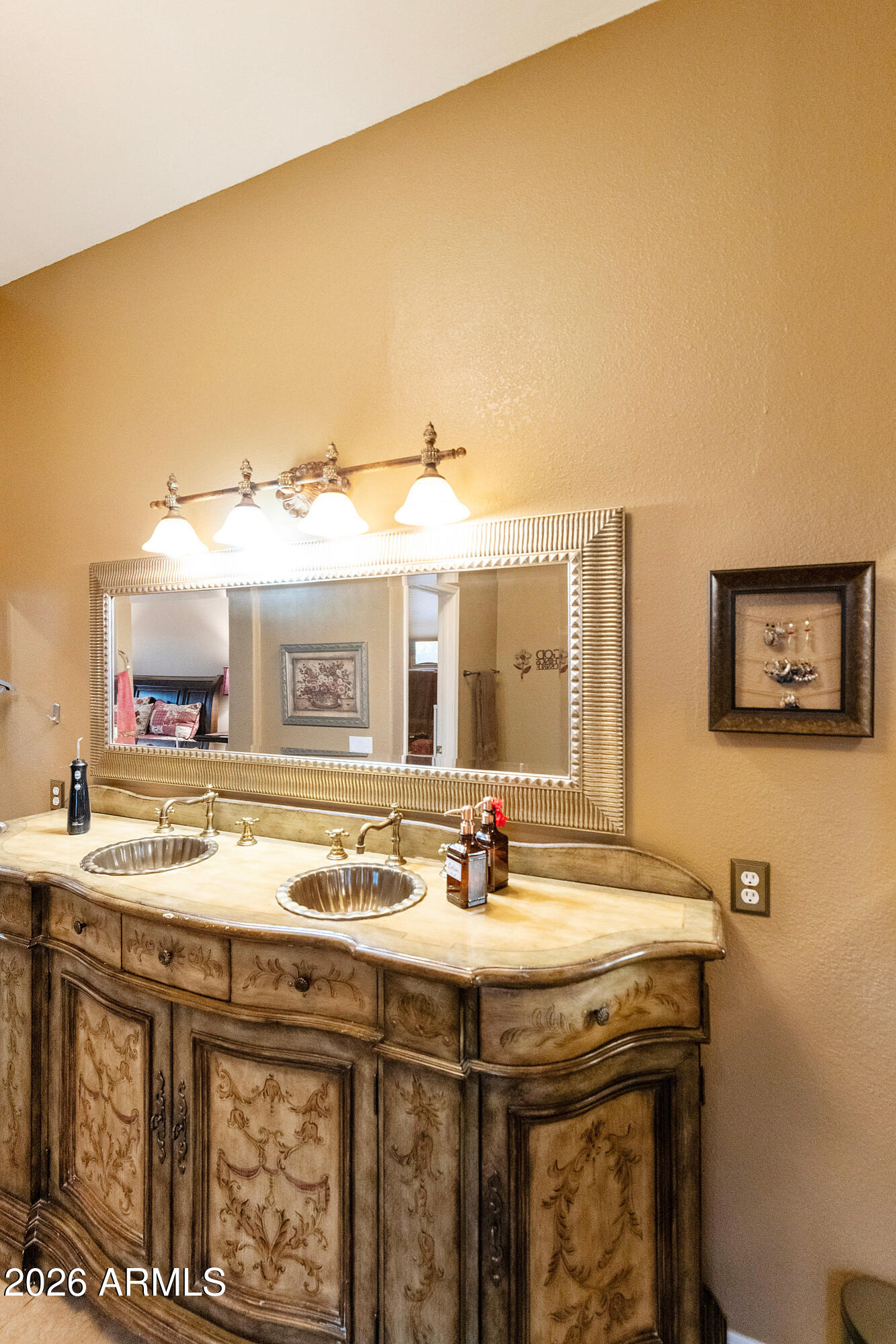 4100 East Strawberry Drive Gilbert, AZ 85298 - Photo 30 of 62 a bathroom with a sink and a mirror