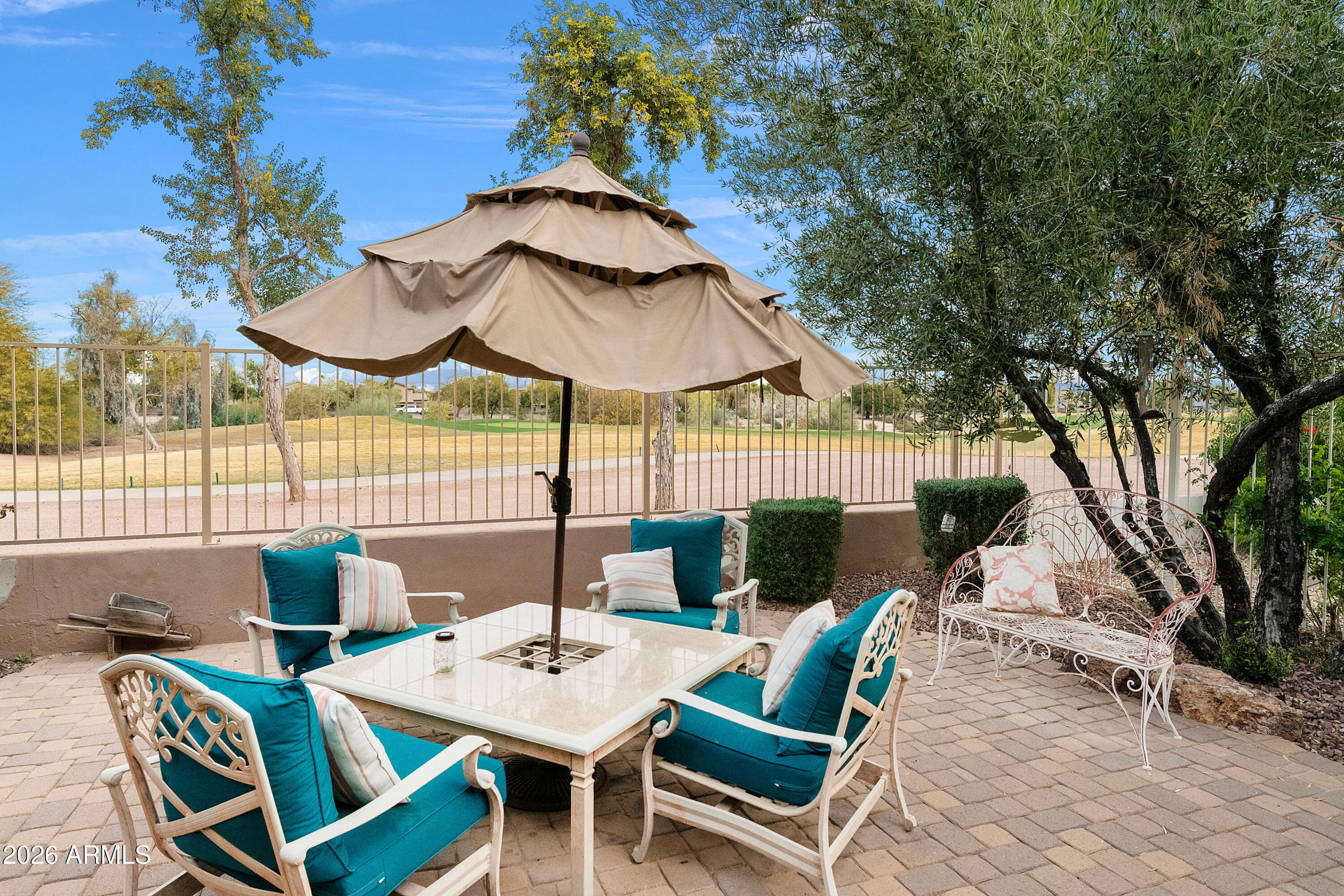 4100 East Strawberry Drive Gilbert, AZ 85298 - Photo 32 of 62 a view of a patio with table and chairs and potted plants
