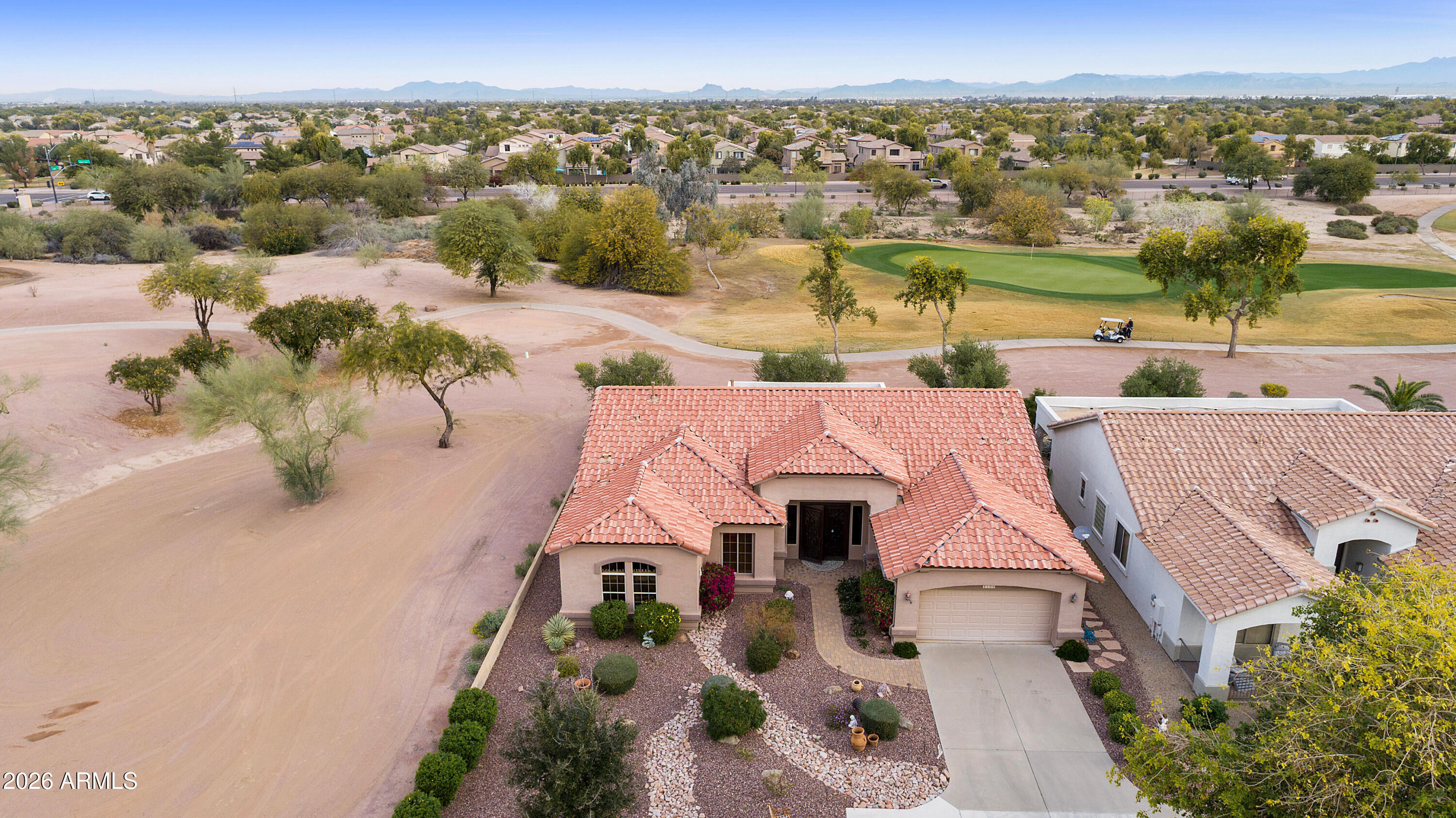 4100 East Strawberry Drive Gilbert, AZ 85298 - Photo 37 of 62 an aerial view of a house with a yard