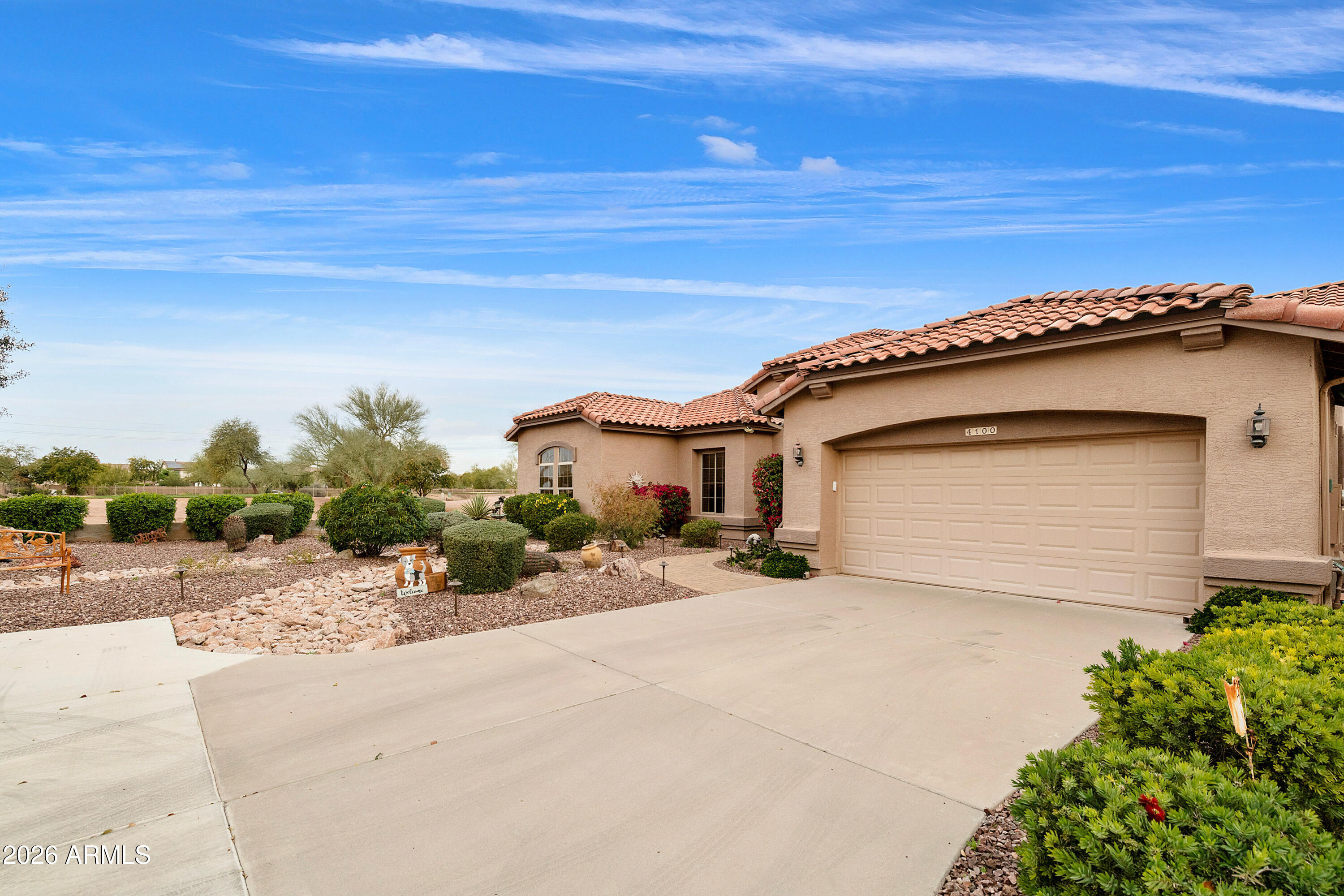 4100 East Strawberry Drive Gilbert, AZ 85298 - Photo 4 of 62 a view of a house with a patio