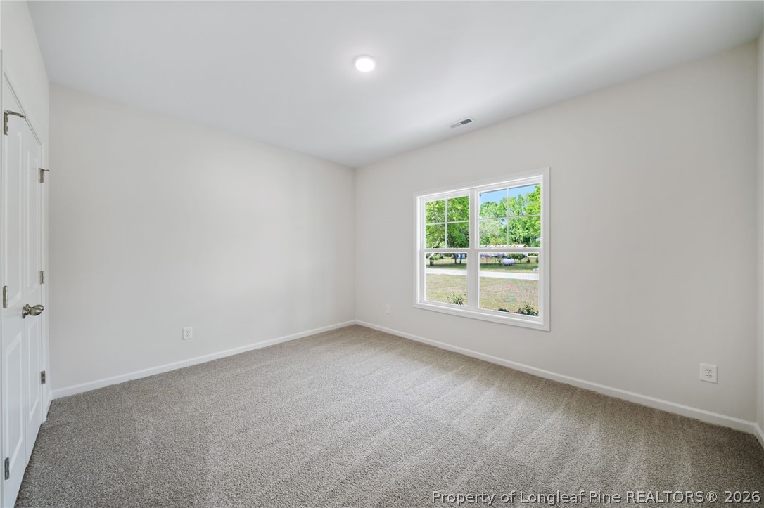 4052 Lofton Street Wade, NC 28395 - Photo 12 of 22 an empty room with windows