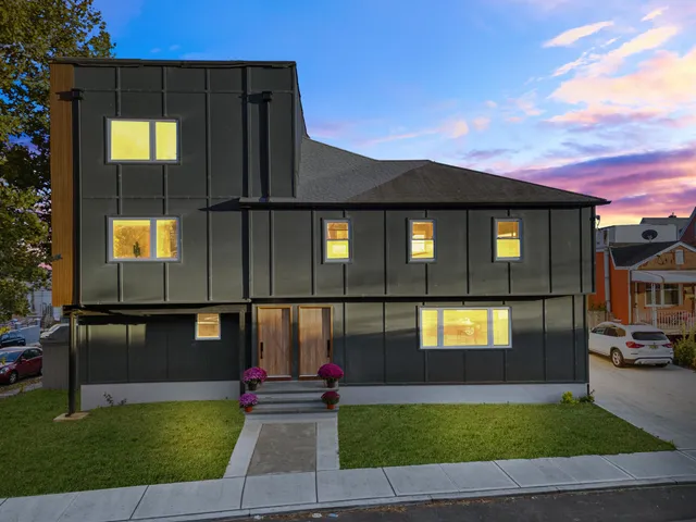 a front view of a house with a yard