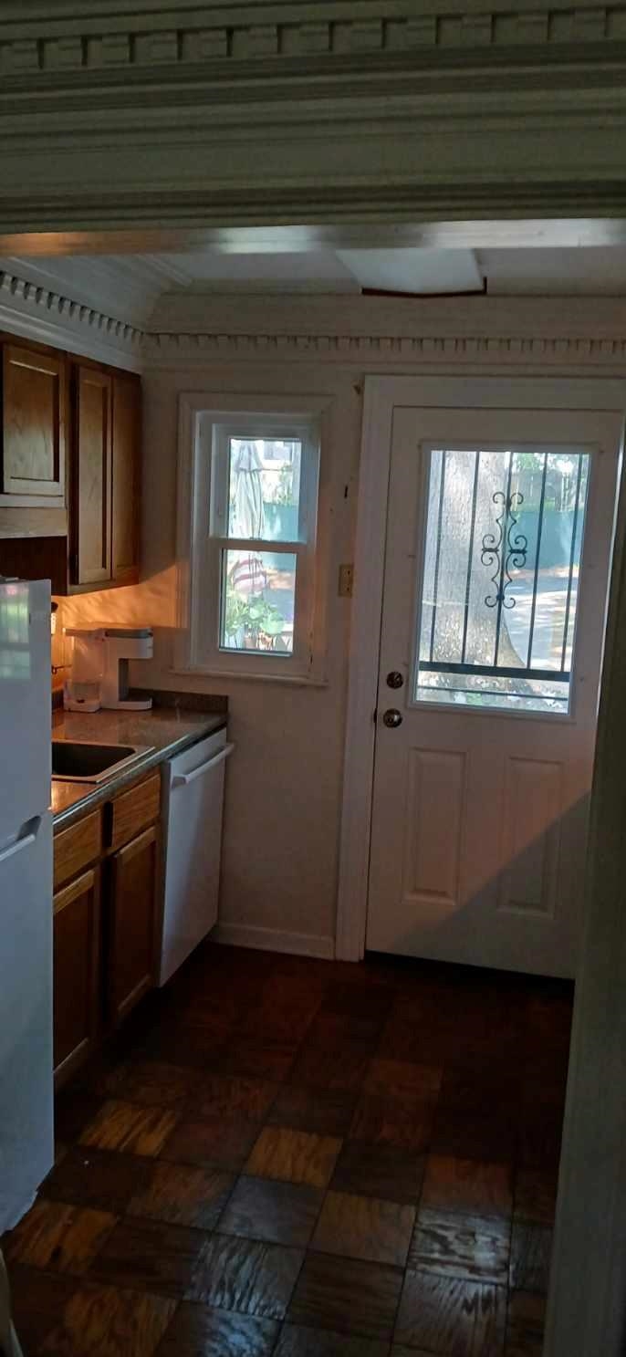 2991 Walnut Grove Road, Unit 2 Memphis, TN 38111 - Photo 6 of 8 a kitchen with granite countertop white cabinets and black appliances