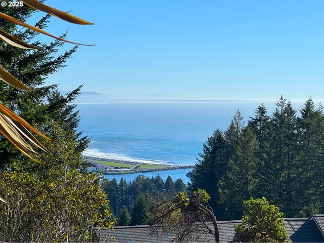 a aerial view of a house with table and chairs in patio