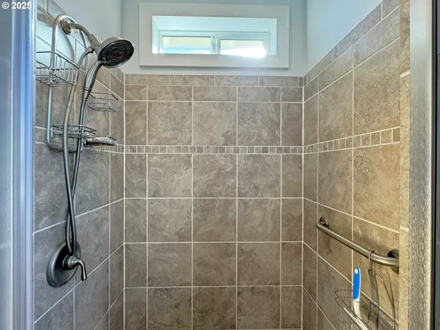 a white toilet sitting next to a window