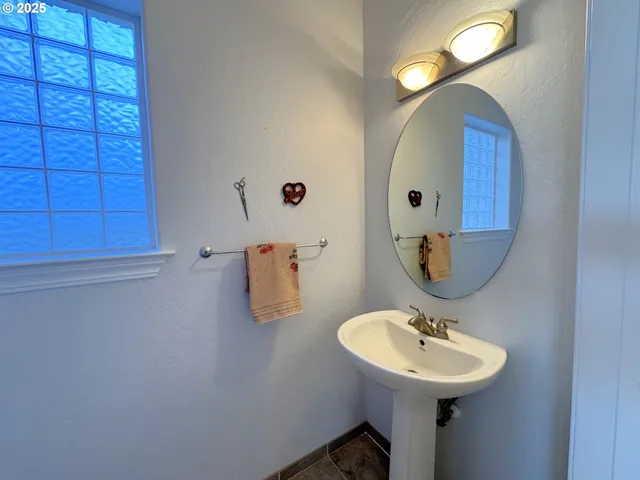 a white toilet sitting next to a window