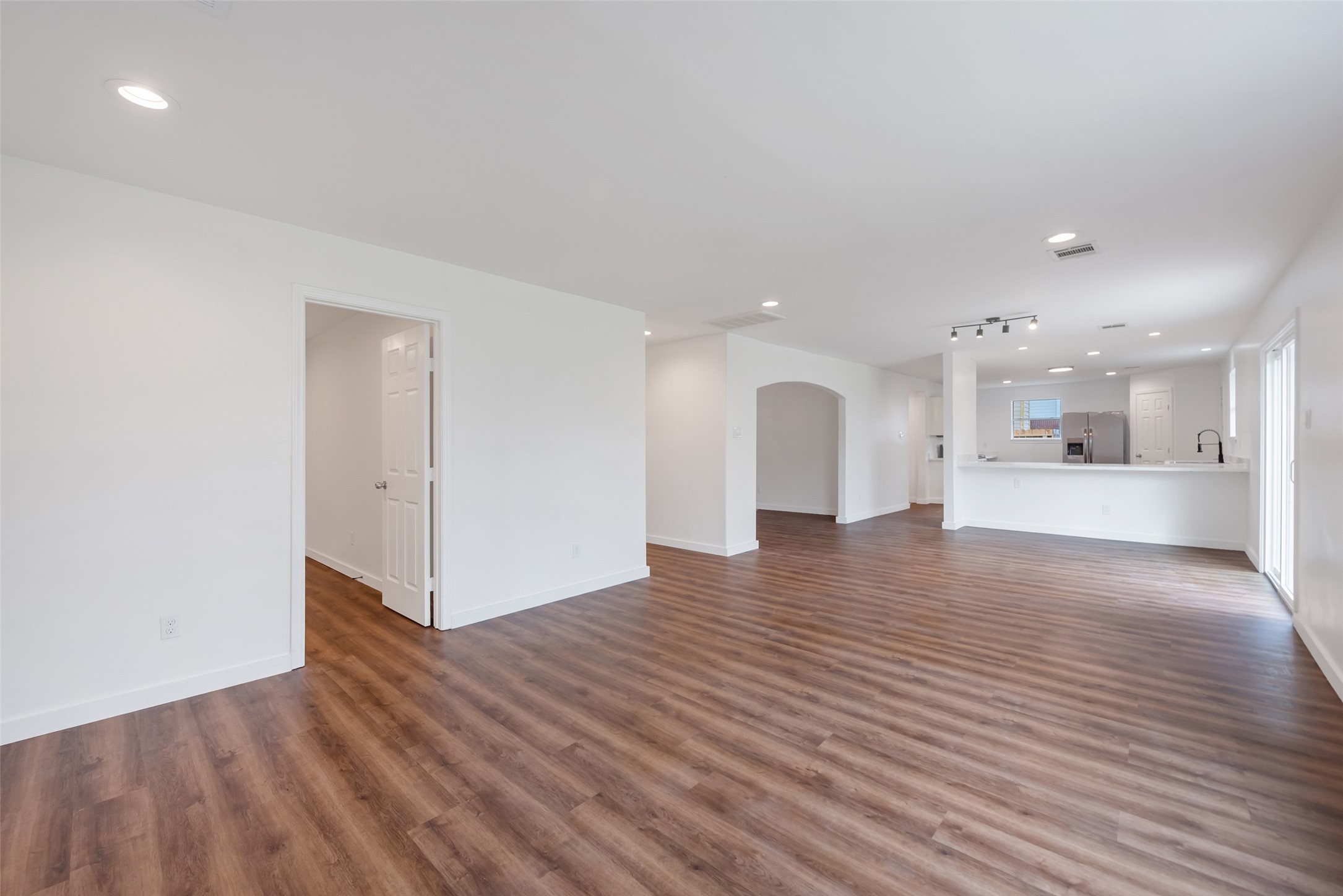 11703 North Perry Avenue Houston, TX 77071 - Photo 14 of 43 a view of a kitchen with a sink and a refrigerator