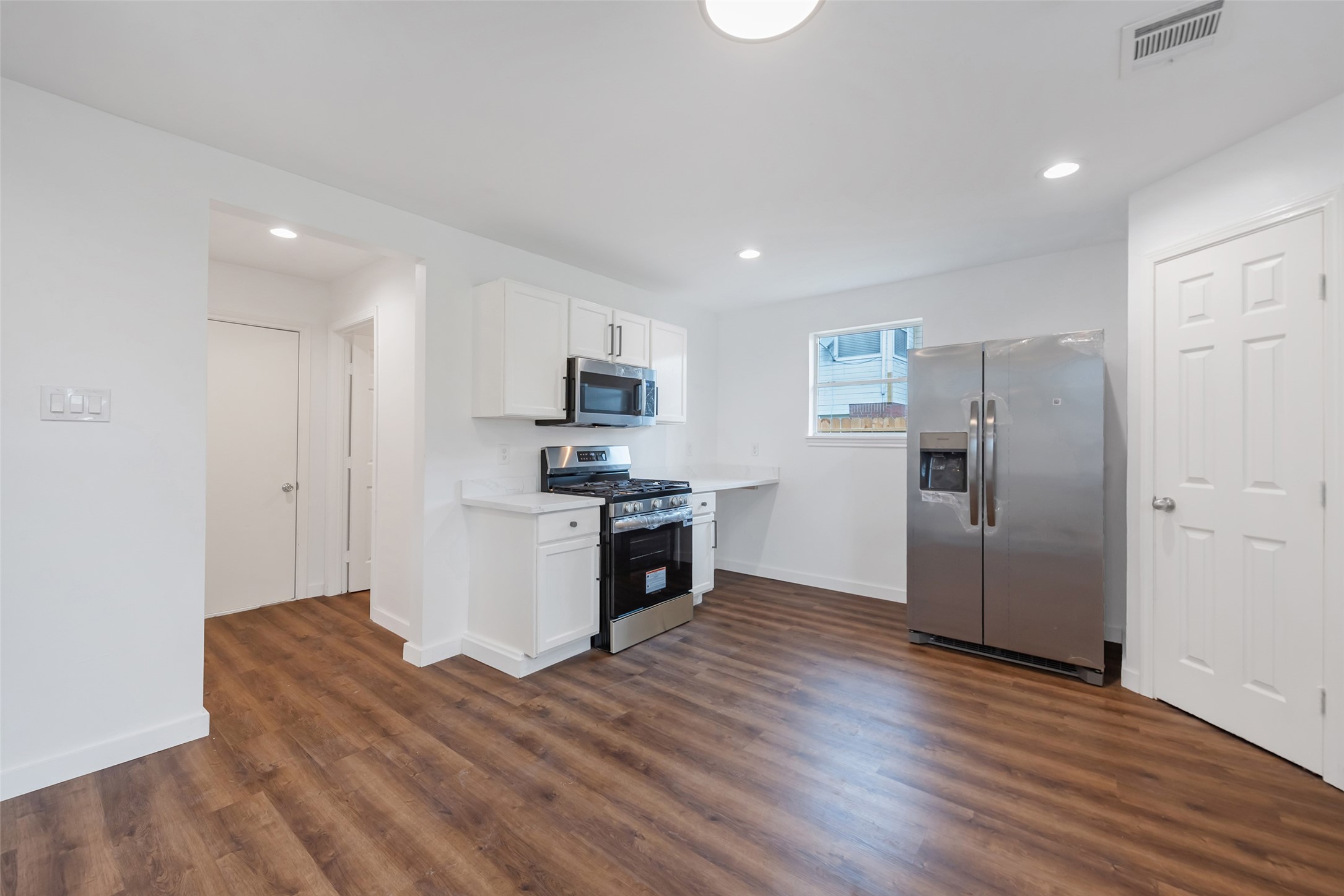 11703 North Perry Avenue Houston, TX 77071 - Photo 15 of 43 a kitchen with stainless steel appliances a refrigerator and a stove top oven