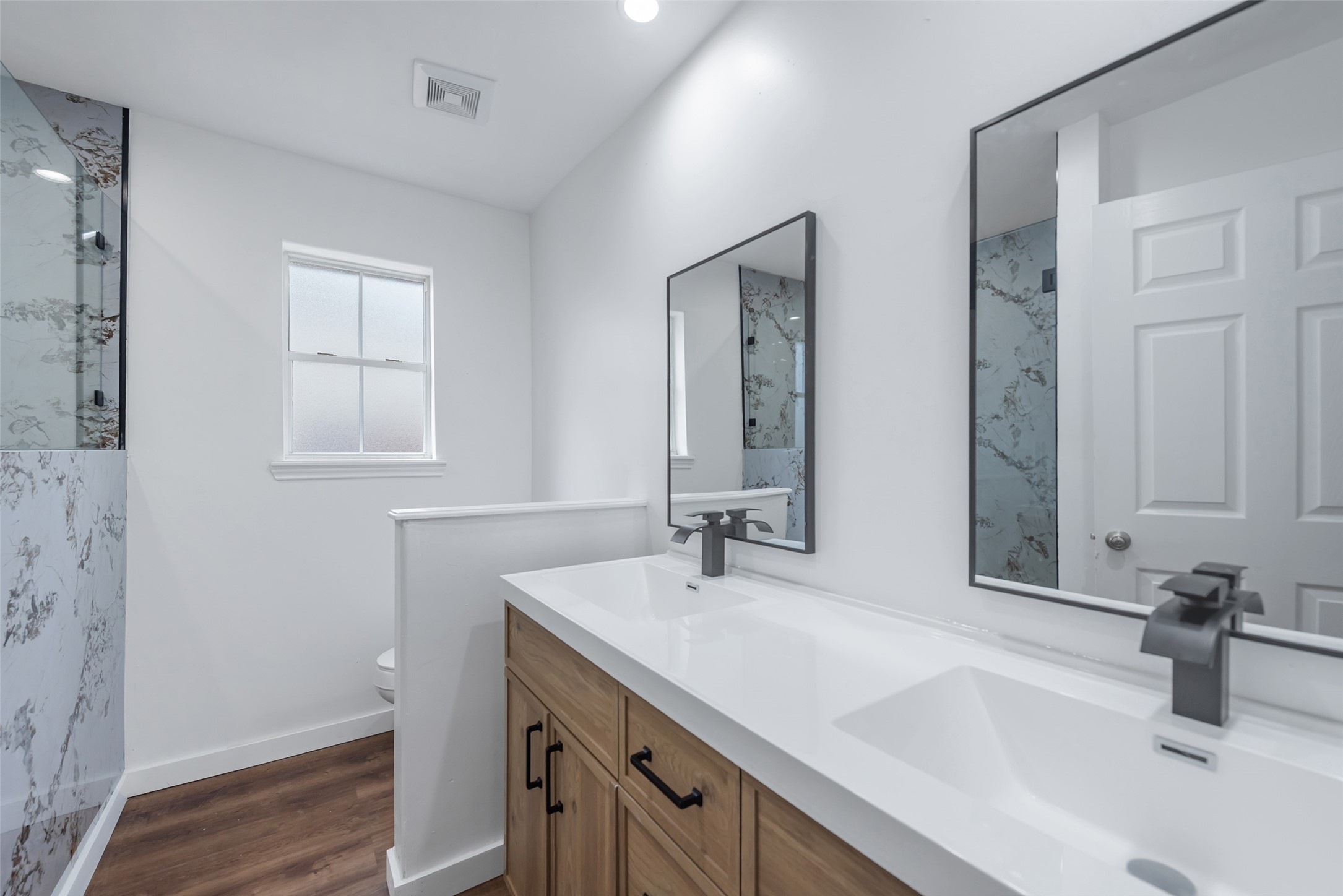 11703 North Perry Avenue Houston, TX 77071 - Photo 24 of 43 a bathroom with a sink and a mirror
