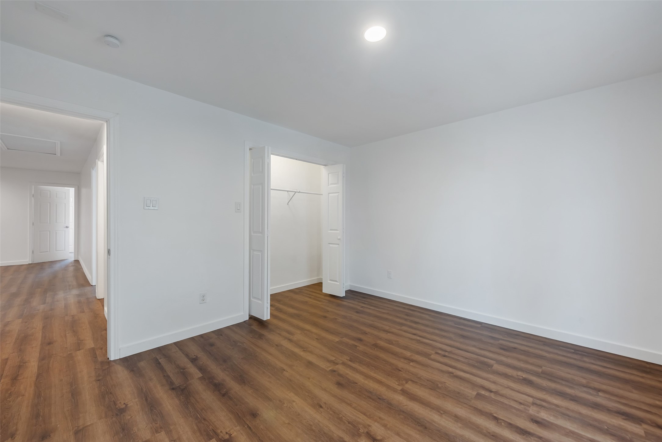 11703 North Perry Avenue Houston, TX 77071 - Photo 27 of 43 wooden floor in a hall with an empty room