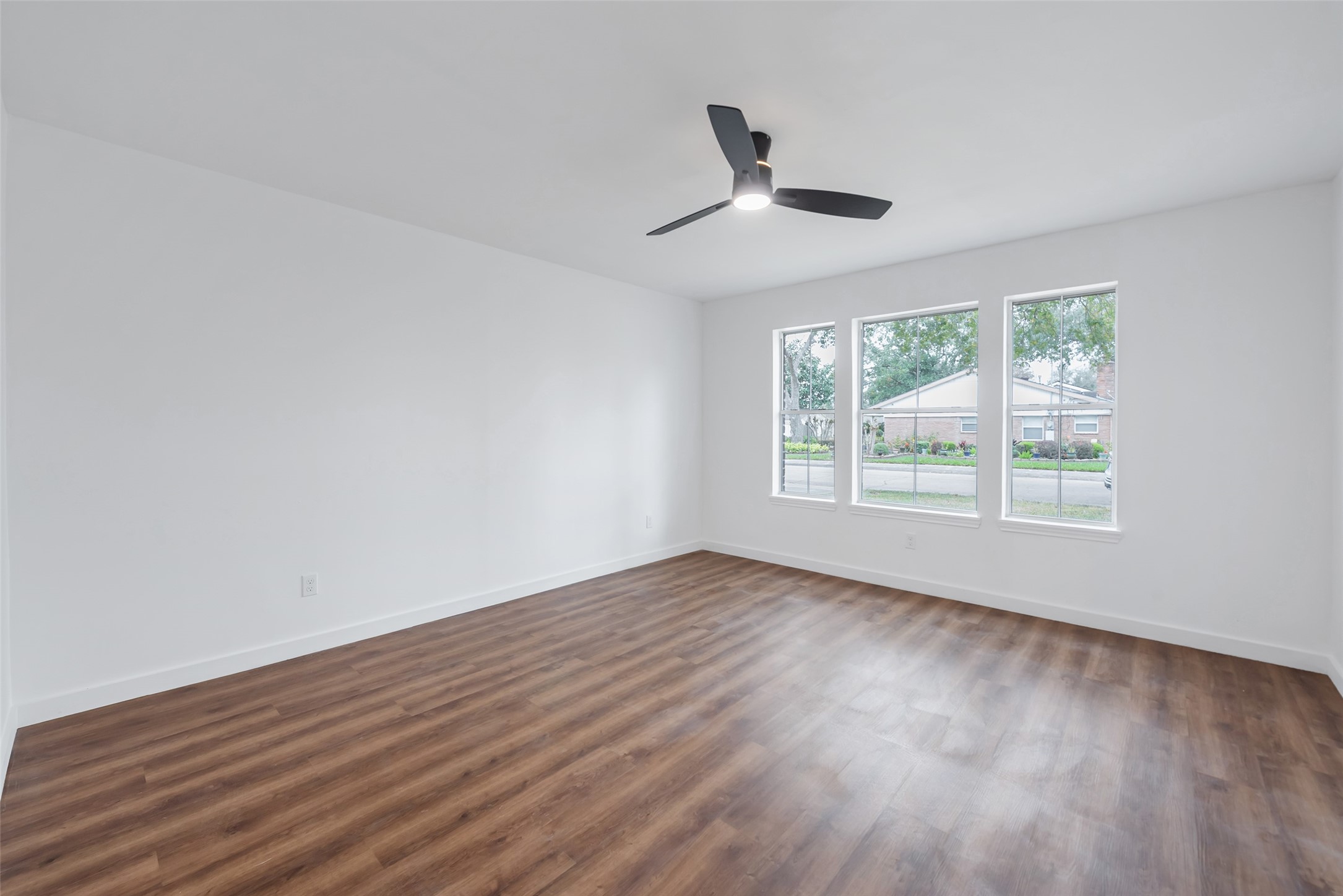11703 North Perry Avenue Houston, TX 77071 - Photo 29 of 43 a view of empty room with wooden floor and fan