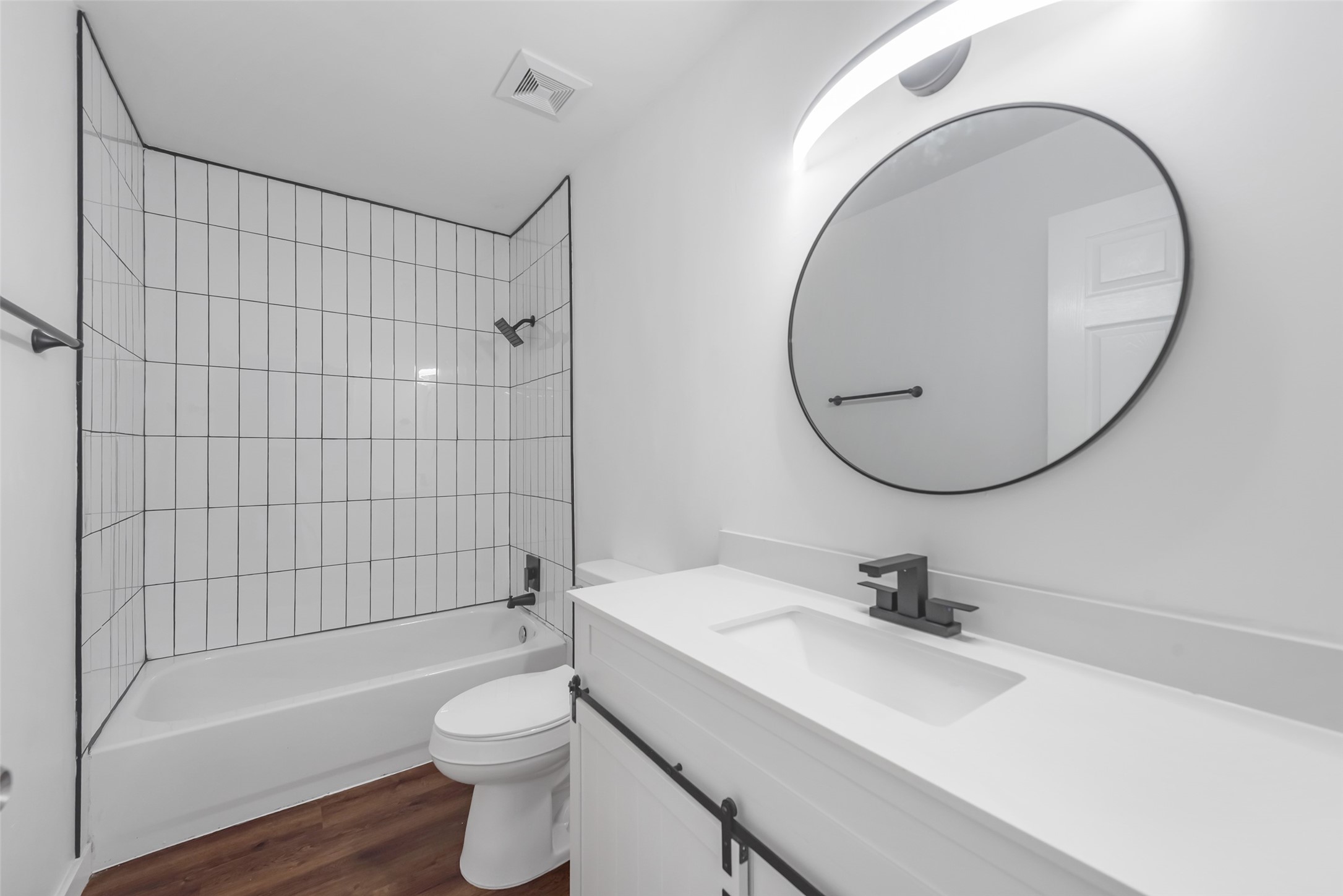 11703 North Perry Avenue Houston, TX 77071 - Photo 31 of 43 a bathroom with a sink a toilet and a mirror