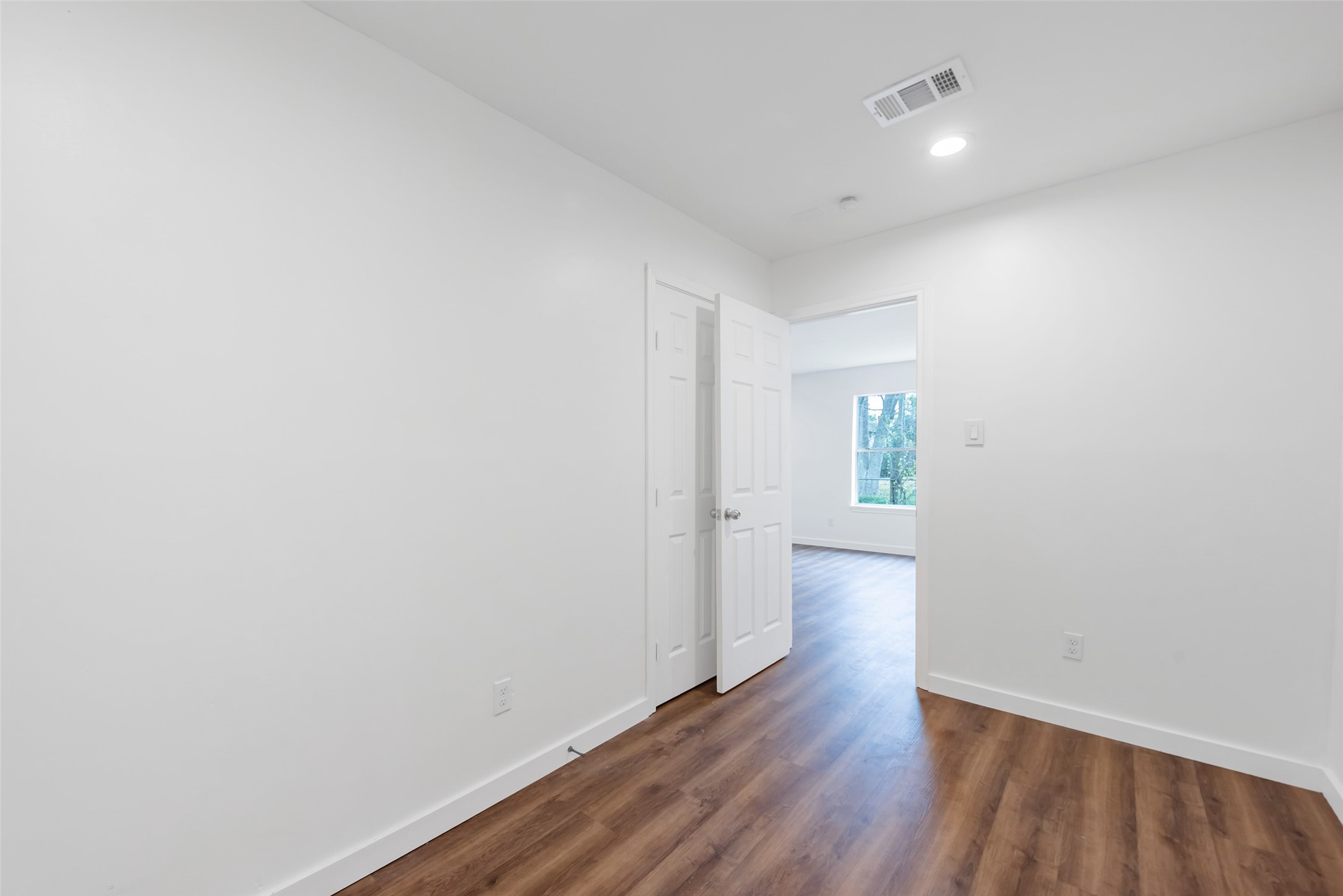 11703 North Perry Avenue Houston, TX 77071 - Photo 33 of 43 a view of a hallway with wooden floor