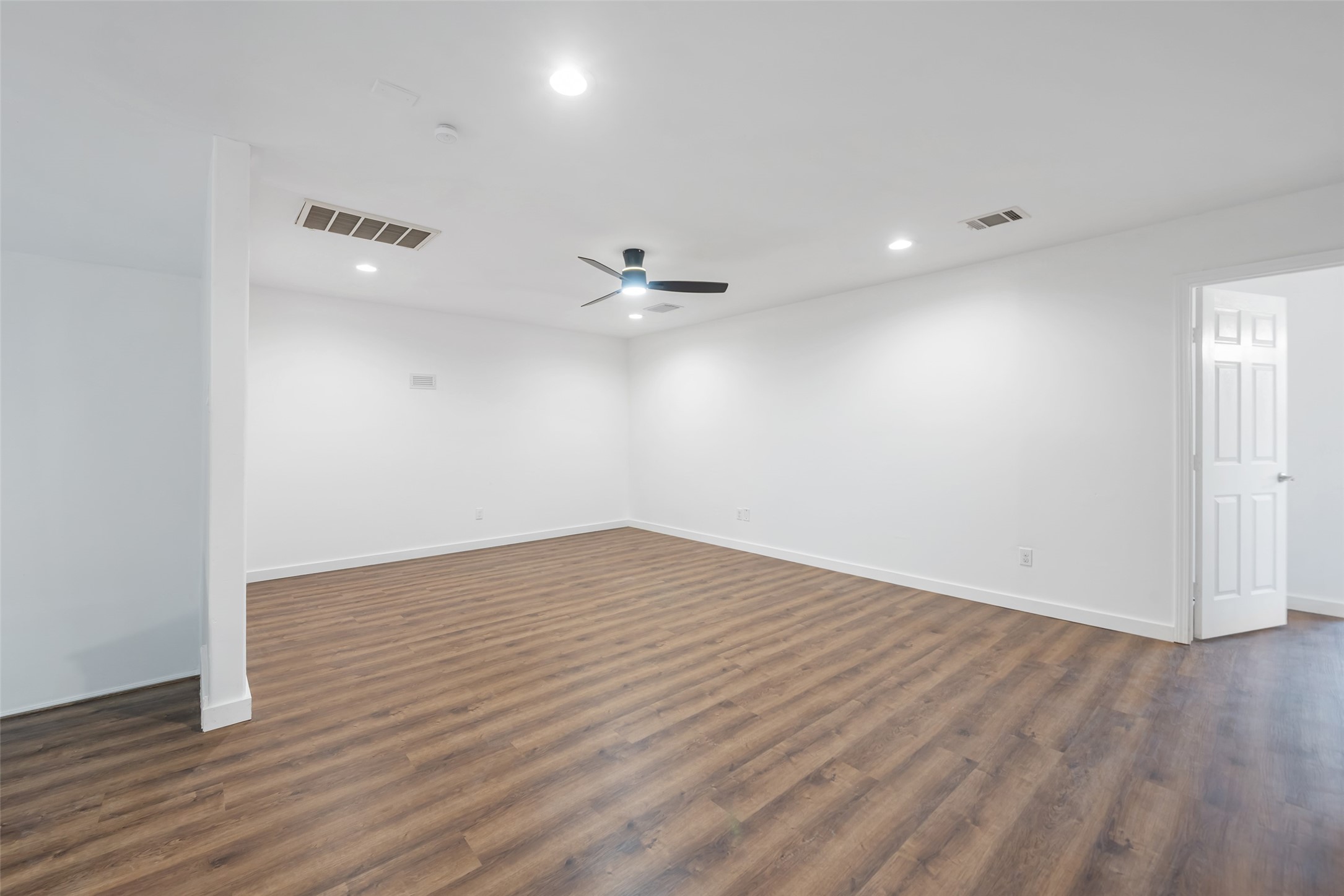 11703 North Perry Avenue Houston, TX 77071 - Photo 37 of 43 a view of an empty room with wooden floor