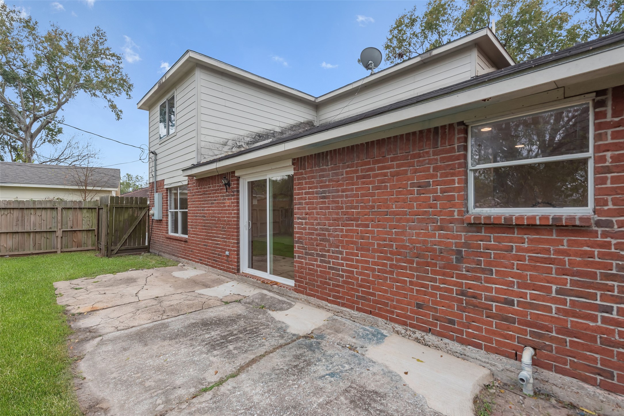 11703 North Perry Avenue Houston, TX 77071 - Photo 39 of 43 a front view of a house with a yard and garage