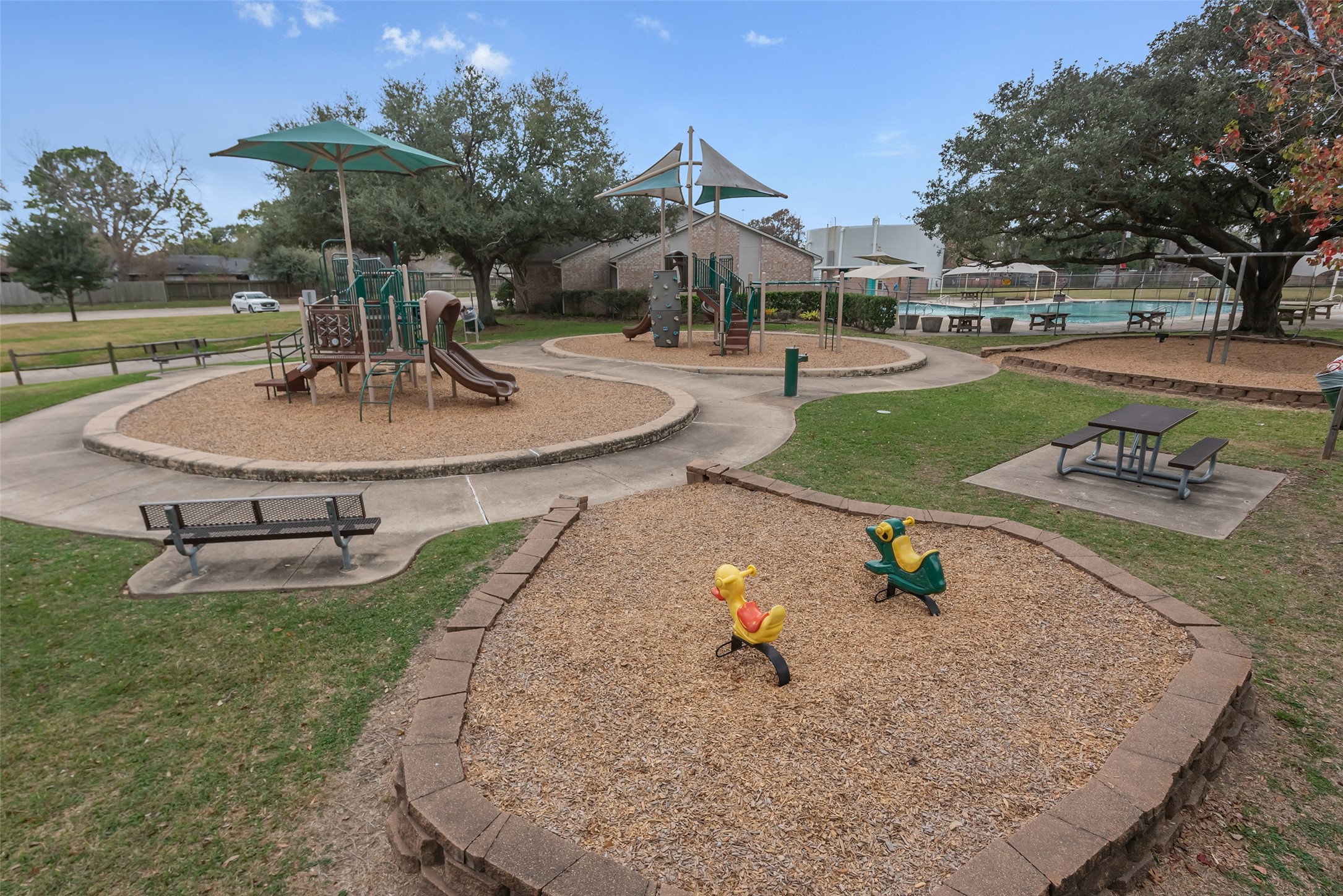 11703 North Perry Avenue Houston, TX 77071 - Photo 41 of 43 a swimming pool with some trees in the background