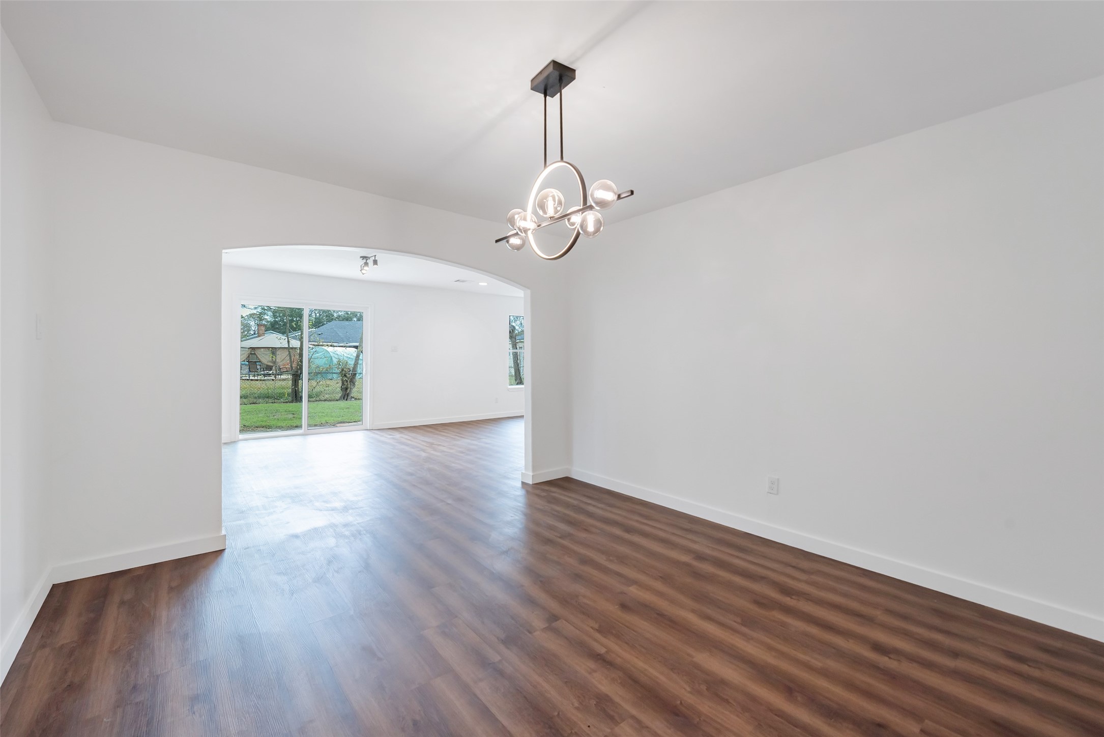 11703 North Perry Avenue Houston, TX 77071 - Photo 7 of 43 a view of a room with wooden floor water heater and a window