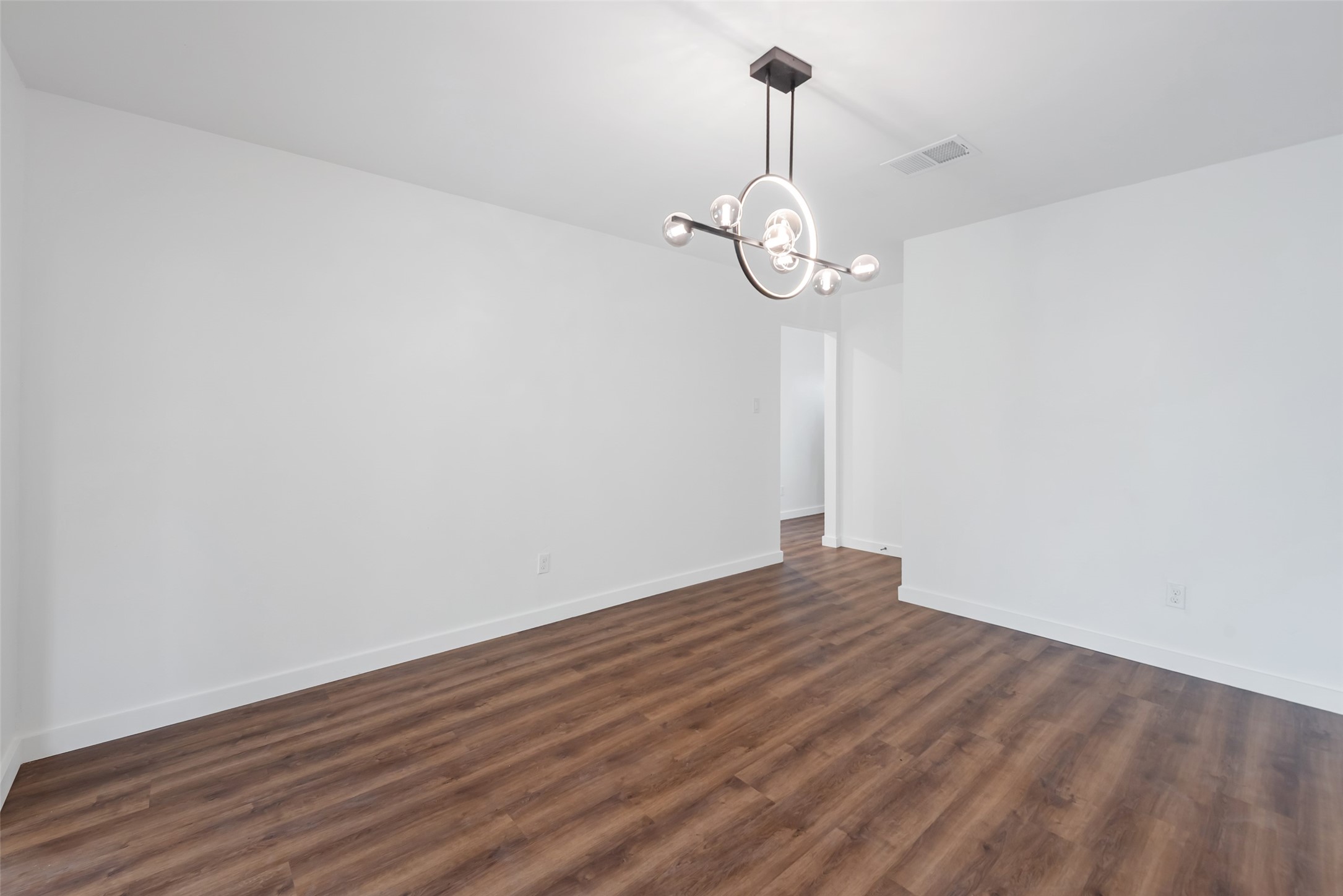 11703 North Perry Avenue Houston, TX 77071 - Photo 8 of 43 a view of a room with wooden floor and white walls