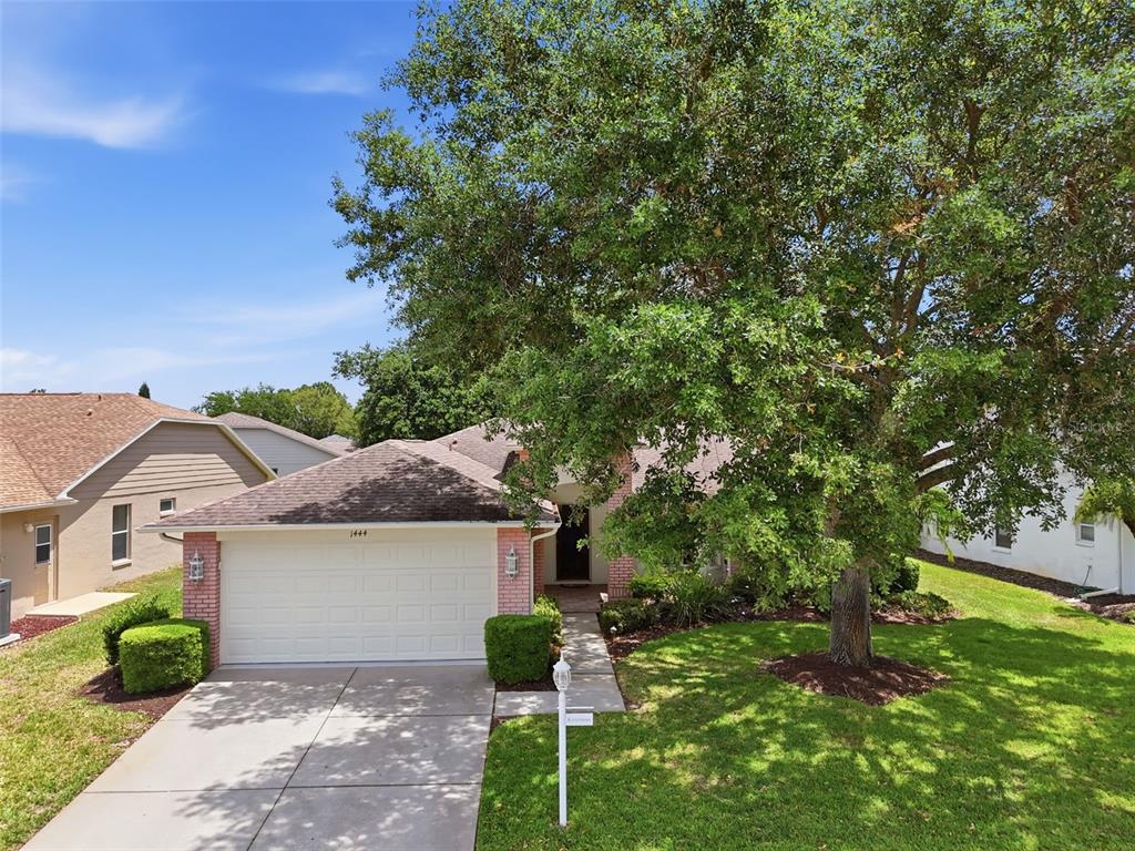 1444 Canberley Court Trinity, FL 34655 - Photo 34 of 52 a front view of a house with garden