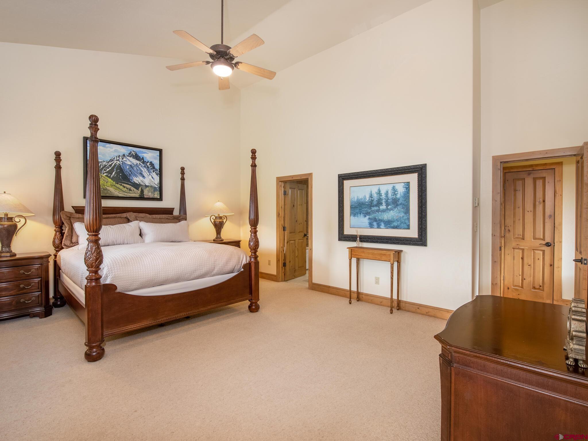 24 Hunter Hill Road, Unit 8 Crested Butte, CO 81225 - Photo 19 of 34 a bedroom with a bed dresser and a window