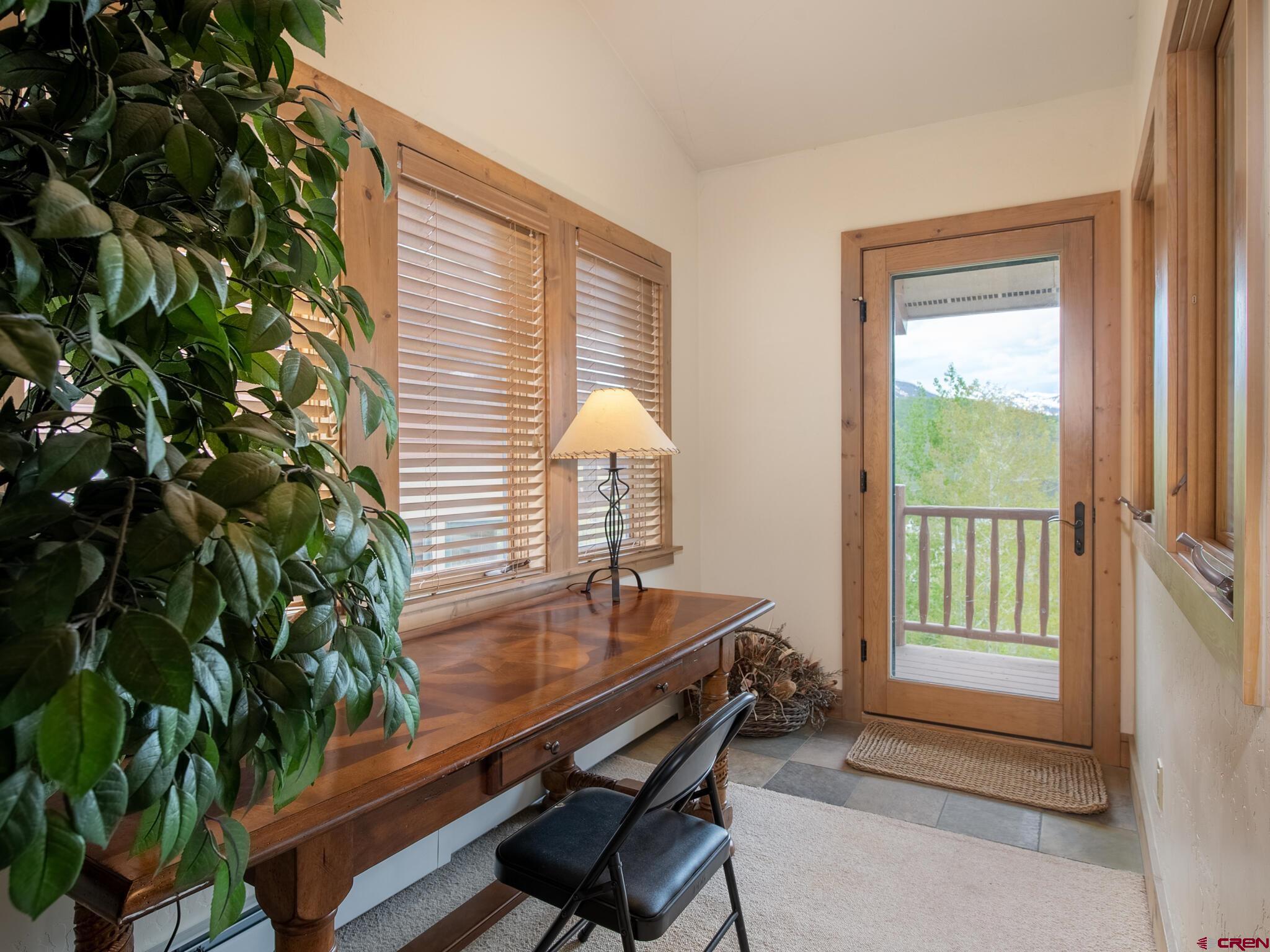 24 Hunter Hill Road, Unit 8 Crested Butte, CO 81225 - Photo 21 of 34 a room with furniture and a potted plant