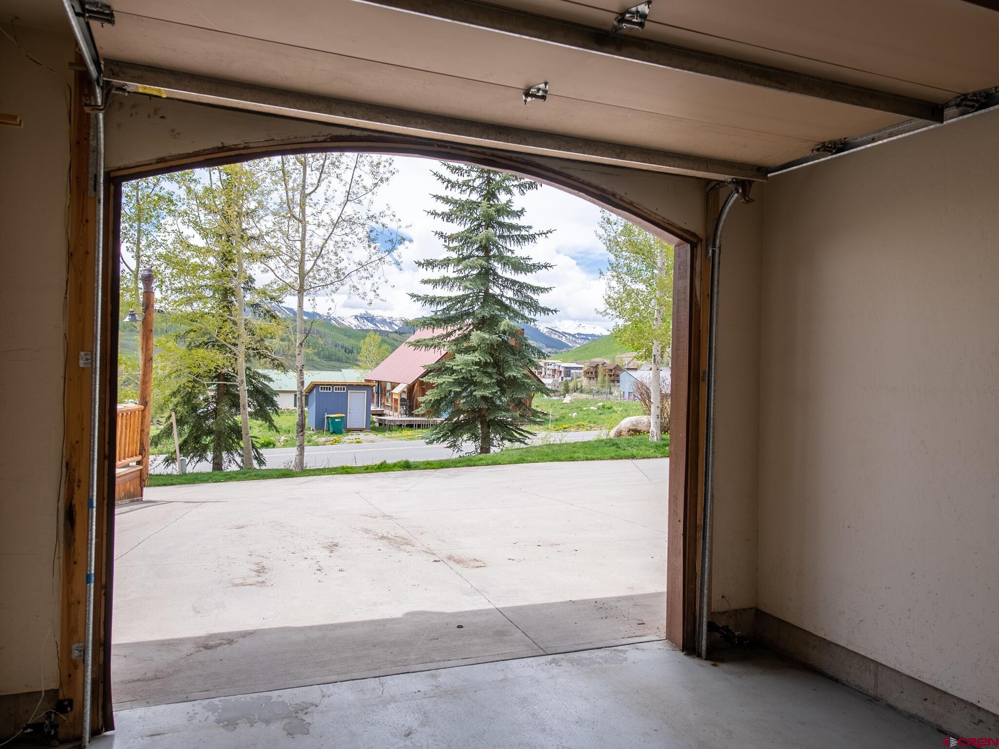 24 Hunter Hill Road, Unit 8 Crested Butte, CO 81225 - Photo 23 of 34 a view of a room with a large window and front door